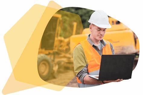 A construction worker using his computer to log into FOUNDATION accounting software